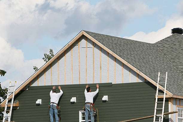 Professional Storm Damage Siding Repair technician working in Polk City, FL